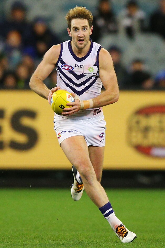 AFL 2016 Rd 14 - Collingwood v Fremantle MELBOURNE, AUSTRALIA - JUNE 24: Michael Barlow of the Dockers runs with the ball during the 2016 AFL Round 14 match between the Collingwood Magpies and the Fremantle Dockers at the Melbourne Cricket Ground on June 24, 2016 in Melbourne, Australia. (Photo by Michael Dodge/AFL Media)